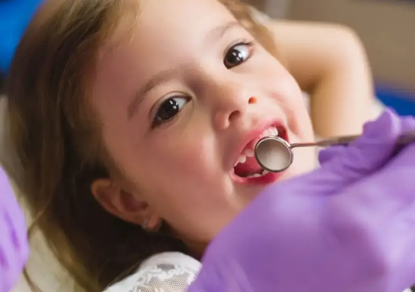 Child having a friendly dental consultation with a dentist